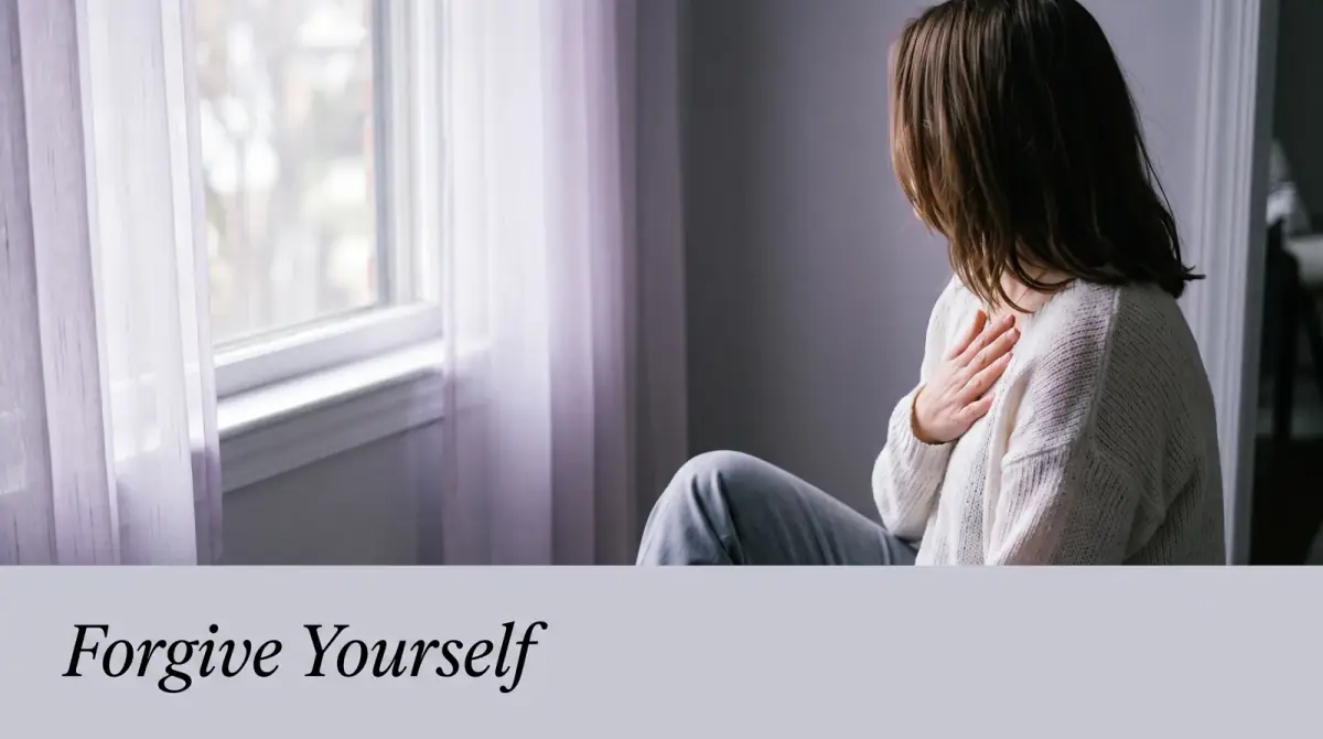 a person resting a hand on their own heart beside a soft window