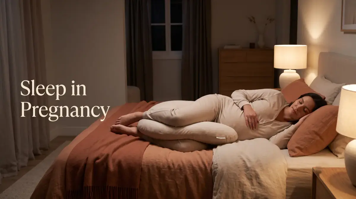 an expectant woman resting on her side in bed with a support pillow between her knees in a calm, dim bedroom
