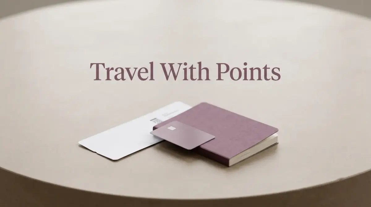 a plain boarding pass, a card and a notebook arranged on a table