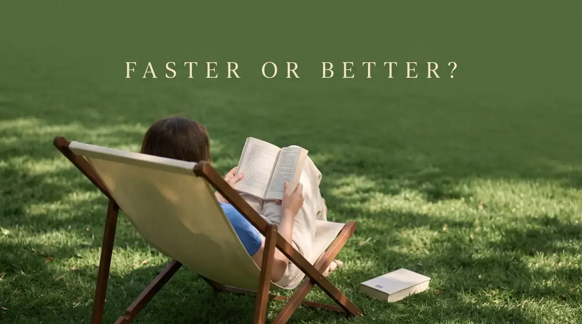 a person reading in a deck chair on a green lawn